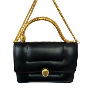 Elegant Black Handbag with Gold Accents